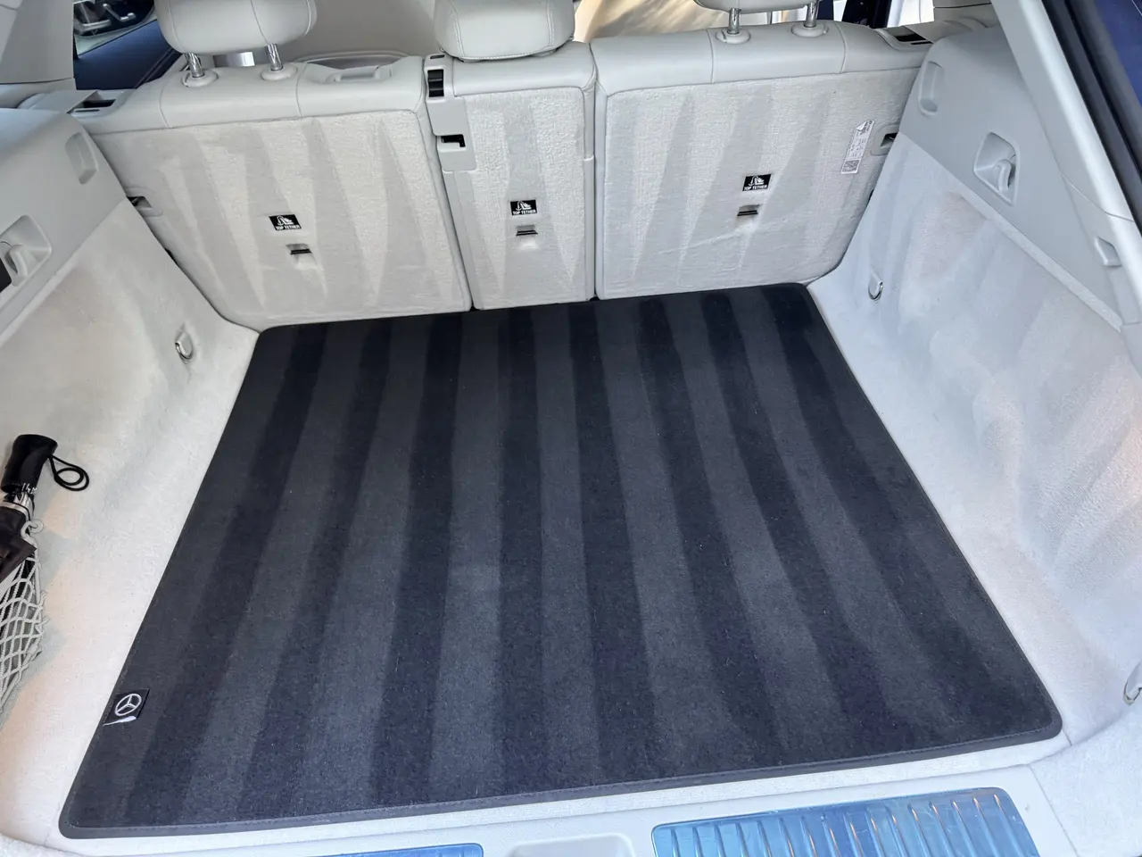 Clean cargo area with freshly vacuumed carpet after detailing