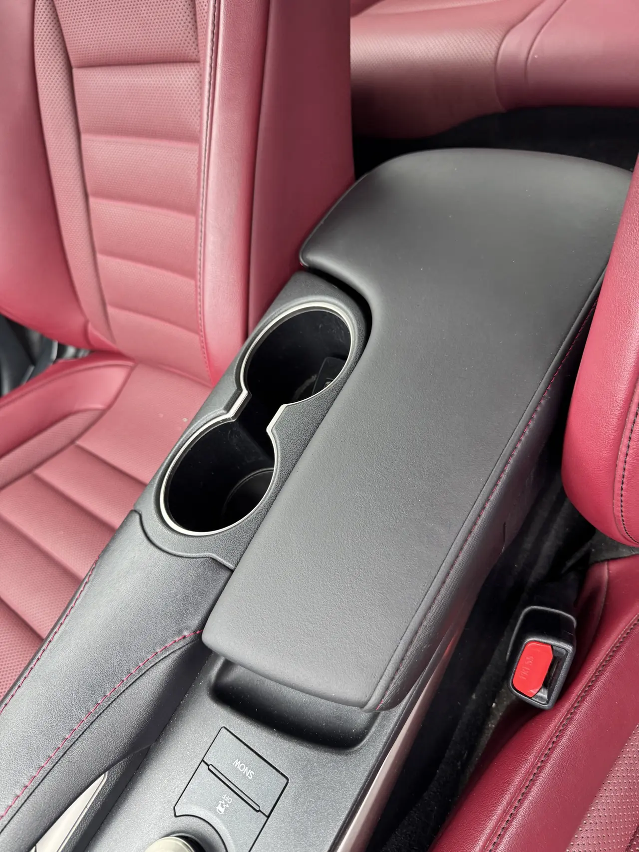Restored leather centre console armrest after repair